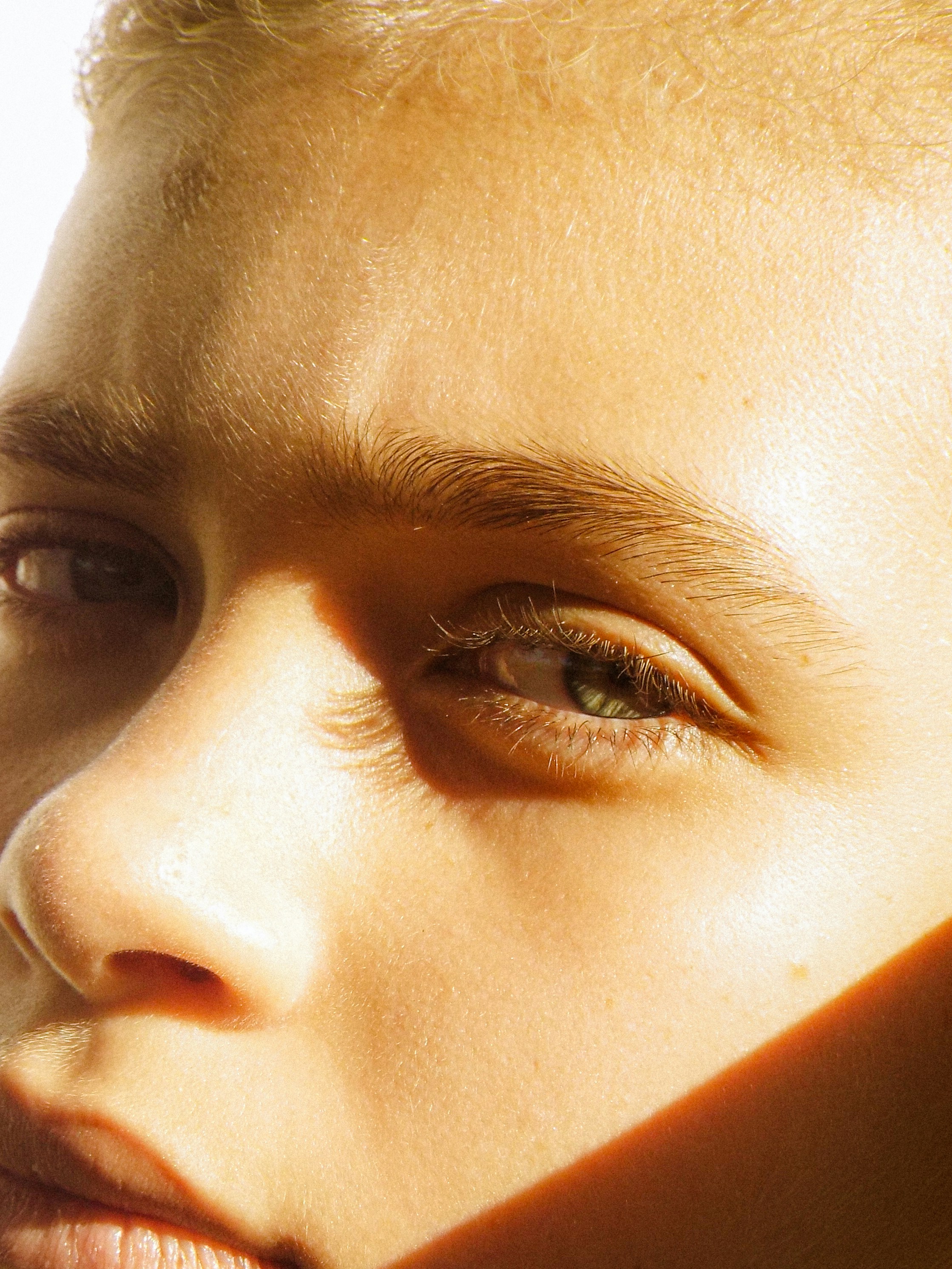Close-up portrait, hand resting near cheek